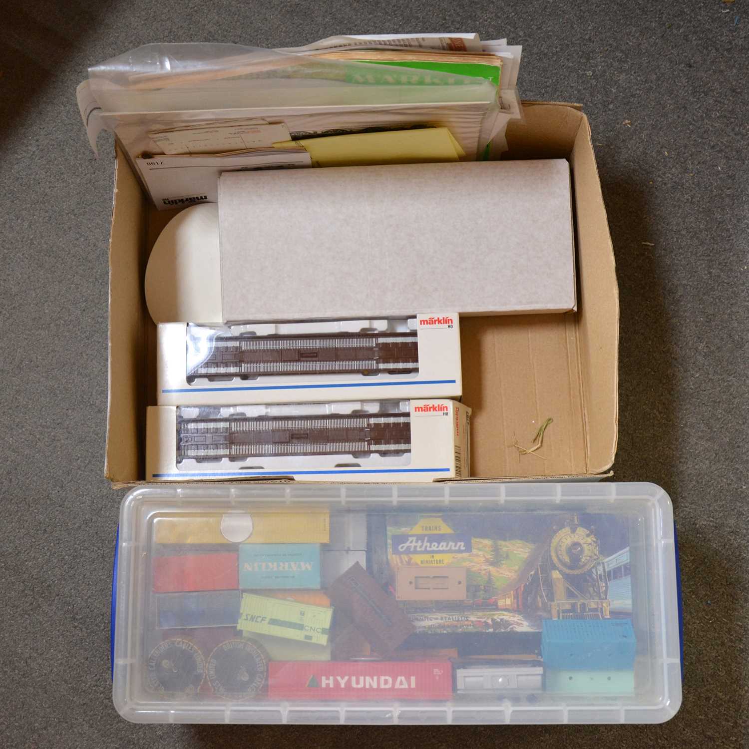 Lot 412 - Two Marklin HO gauge flatbed wagons, with others and a box of loose shipping containers