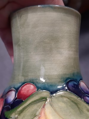 Lot 17 - Walter Moorcroft for Moorcroft, a vase in the Leaf & Berry design.