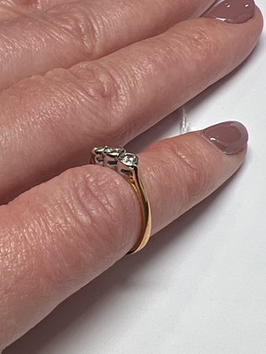 Lot 45 - A diamond three stone ring.