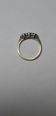 Lot 45 - A diamond three stone ring.