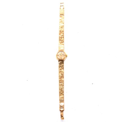 Lot 406 - Omega - a lady's 9 carat yellow gold bracelet wristwatch.