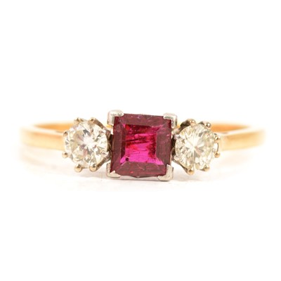 Lot 4 - A ruby and diamond three stone ring.