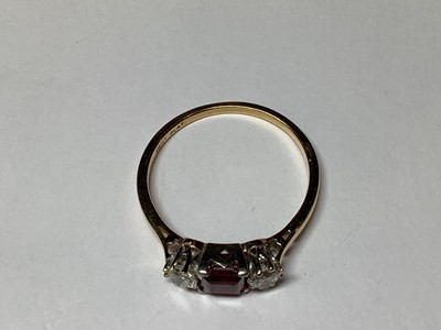 Lot 4 - A ruby and diamond three stone ring.