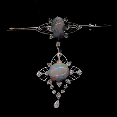 Lot 180 - An opal and diamond brooch with pendant drop.