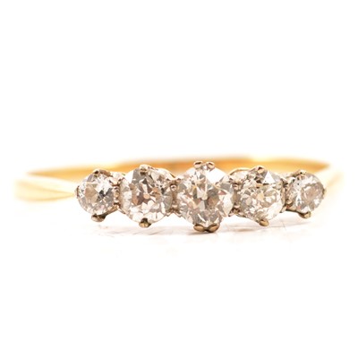 Lot 71 - A diamond five stone half hoop ring.