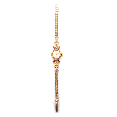 Lot 410 - Girard Perregaux - a lady's 18 carat yellow gold, ruby and diamond cocktail wristwatch.