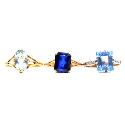 Lot 88 - Three dress rings, aquamarine, synthetic blue spinel, and synthetic sapphire.