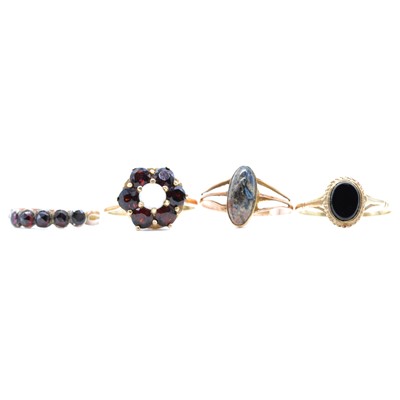Lot 83 - Four gemset rings, opal and garnet, jasper, onyx.
