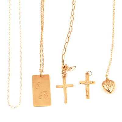 Lot 150 - A small collection of 9 carat yellow gold and yellow metal pendants, crosses and chains.