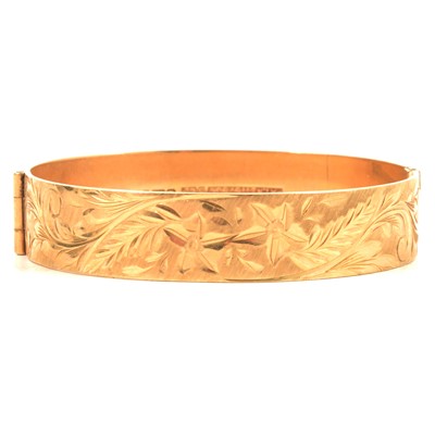 Lot 226 - A 9 carat yellow gold half hinged bangle.