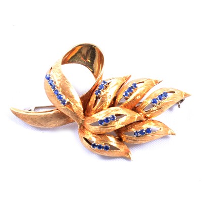 Lot 178 - An 18 carat yellow gold spray brooch set with sapphires.