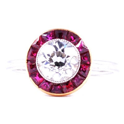 Lot 38 - A ruby and diamond reverse cluster ring.