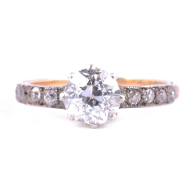 Lot 59 - A diamond solitaire ring with diamond shoulders.