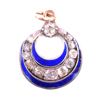 Lot 193 - A diamond and blue enamel pendant.