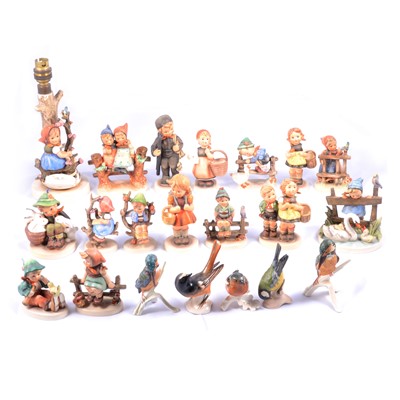 Lot 16 - Collection of fifteen Hummel figurines and a lamp base
