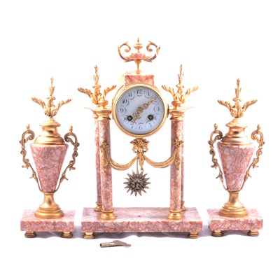 Lot 121 - French gilt metal and rouge marble three-piece clock garniture