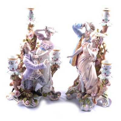 Lot 114 - A pair of three light figural porcelain candelabra, Blind Man's Buff.