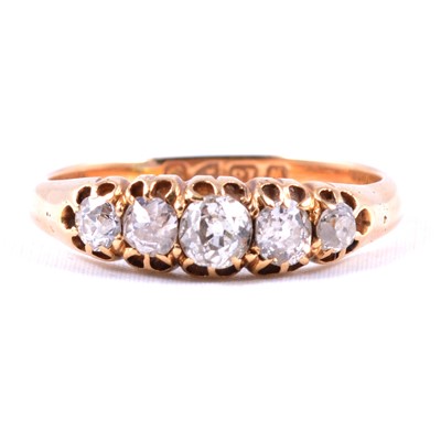 Lot 73 - An Edwardian diamond five stone ring.