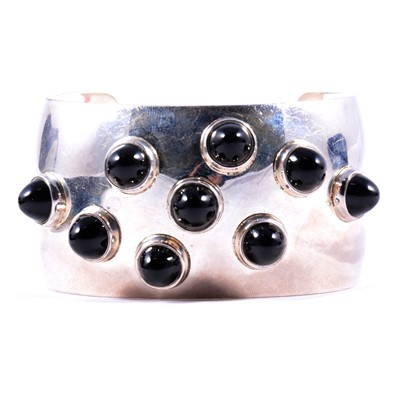 Lot 321 - Georg Jensen of Denmark - a Michelsen black onyx cuff bangle.