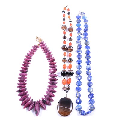 Lot 293 - A banded agate and cornelion necklace, lapis necklace and a ruby/zoisite necklace.