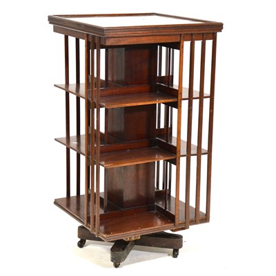 Lot 431 - Edwardian walnut revolving book rack