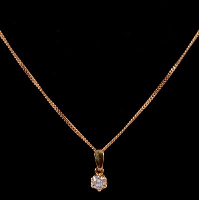 Lot 194 - A solitaire diamond pendant and chain.