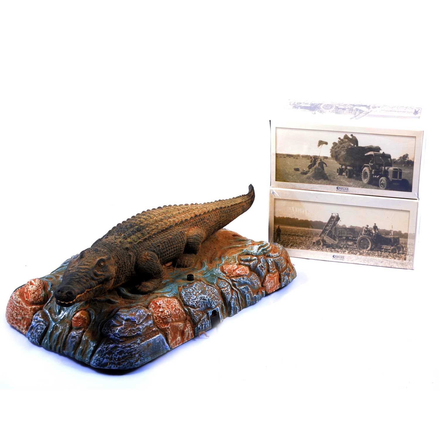 Lot 93 - Twenty-Six Atlas die-cast model agricultural vehicles, with singing Crocodile model