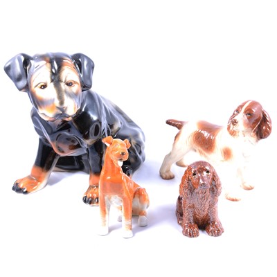 Lot 83 - Salt-glazed model of a seated spaniel, and collection of other ceramic dog figurines