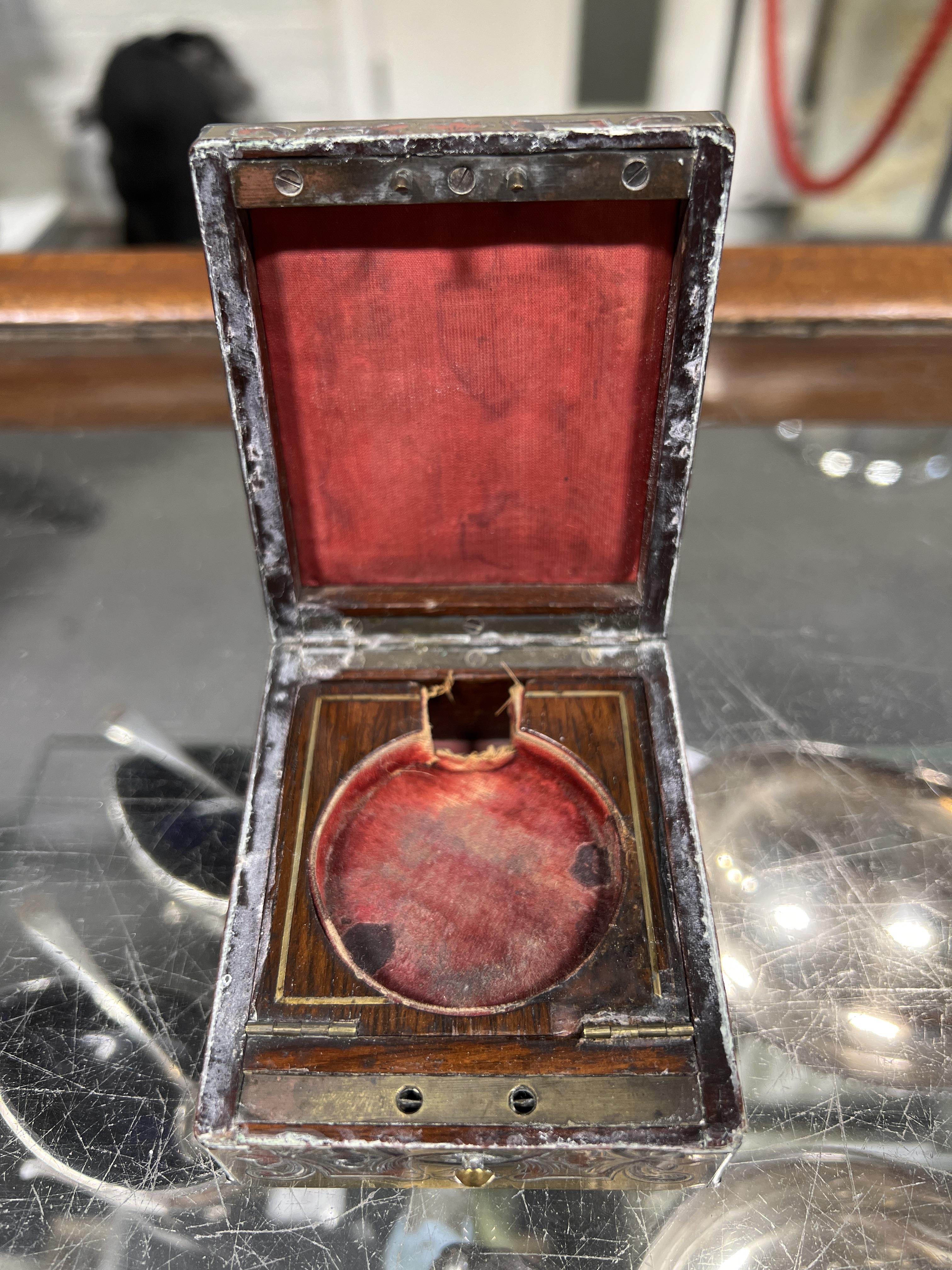 Lot 187 - Two ebonised snuff boxes, a brass pepper pot,