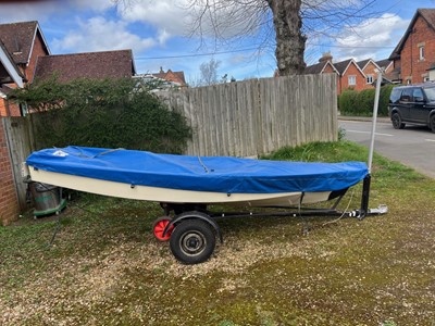 Lot 541 - 13ft dinghy sailboat, wooden, on launch trailer.