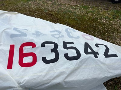 Lot 540 - 14ft Laser class dinghy sailboat, on trailer