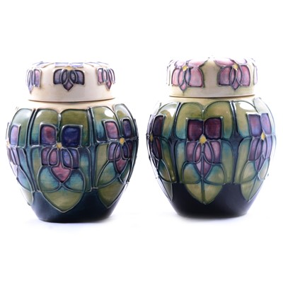 Lot 30 - Sally Tuffin for Moorcroft Pottery, two 'Violets' pattern ginger jars and covers