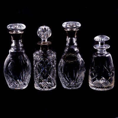 Lot 90 - Near pair of silver-mounted decanters, another silver-mounted decanter, and others