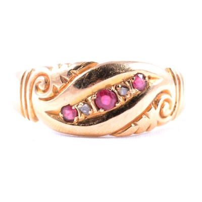 Lot 44 - An 18 carat gold ring set with small rubies.