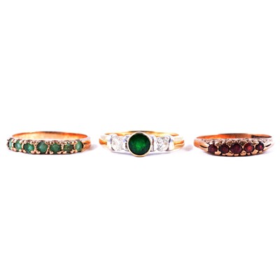 Lot 35 - Three gemset rings, emerald, garnet.