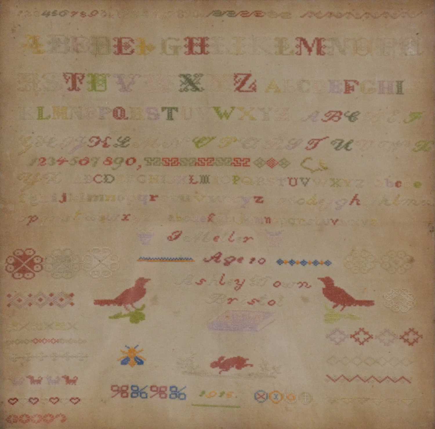 Lot 99 - Ashley Down needlework sampler, and another