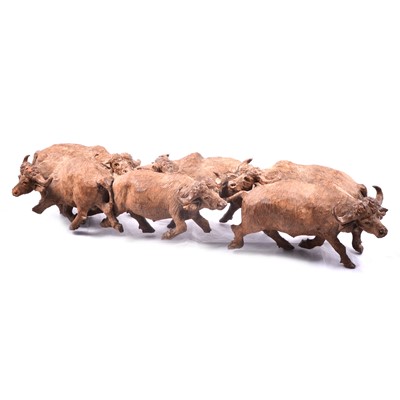 Lot 250 - Carved hardwood group of six water buffalo