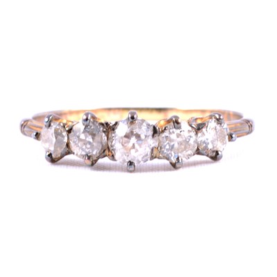 Lot 72 - A diamond five stone ring.