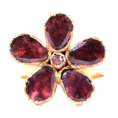 Lot 24 - A garnet floral dress ring in the Georgian style.
