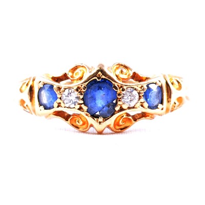 Lot 57 - A sapphire and diamond five stone ring.