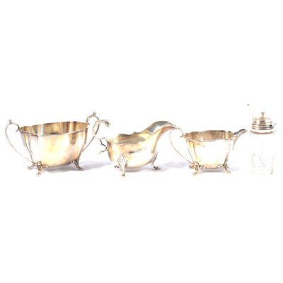 Lot 252 - Silver milk jug and sugar bowl, silver mounted preserve jar and a sauce boat