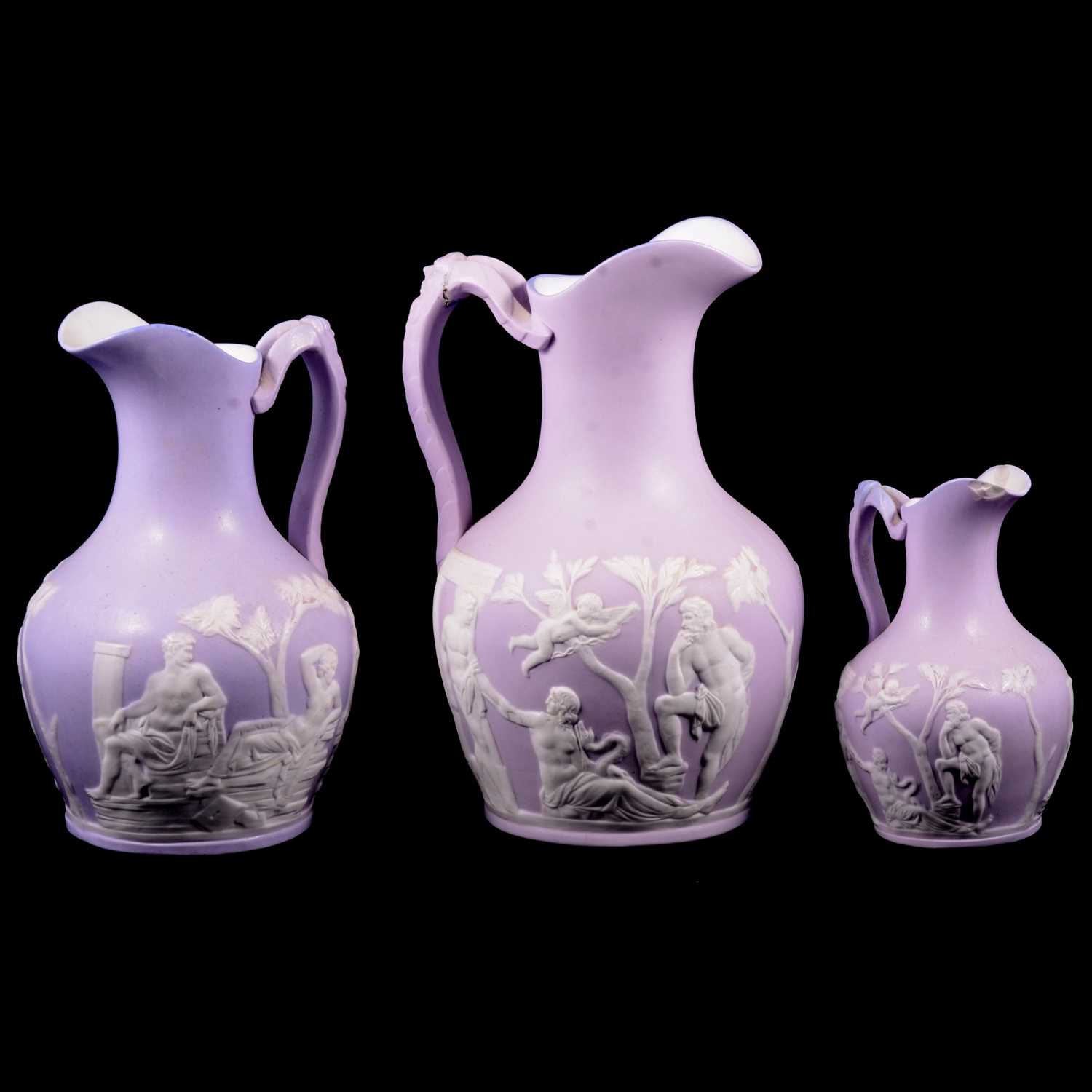 Lot 54 - Set of three Samuel Alcock Portland jugs and a majolica jug