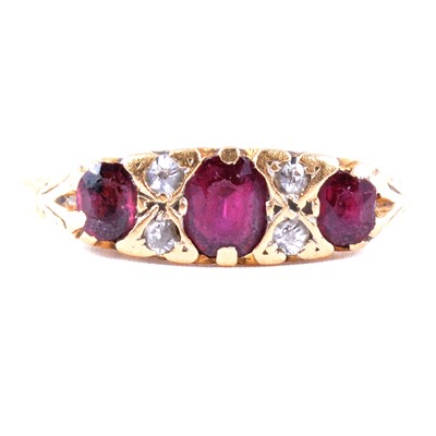 Lot 42 - A ruby and diamond half hoop ring.