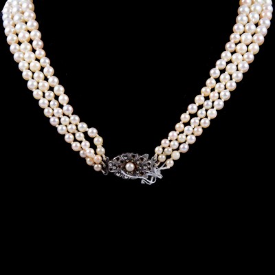 Lot 305 - A three row cultured pearl necklace.