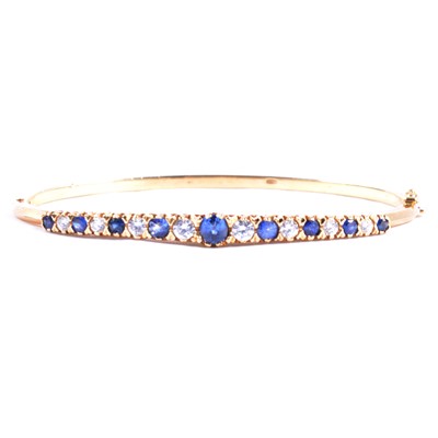 Lot 246 - A sapphire and diamond Victorian style bangle.