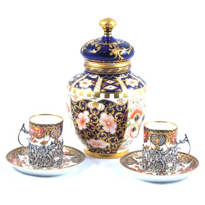 Lot 15 - A set of six Royal Crown Derby demi-tasse in silver holders and a similar jar and cover.