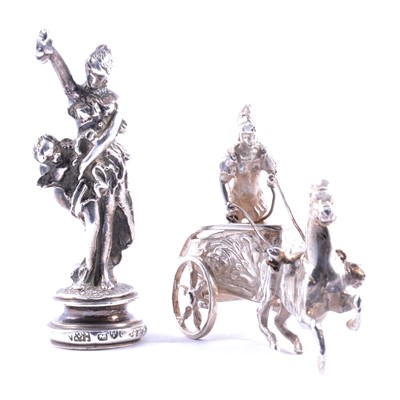 Lot 297 - Cast silver figural seal, and a small silver model of a charioteer