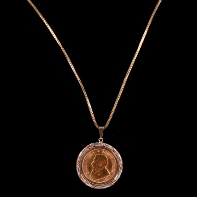 Lot 122 - A Gold  1/10 Krugerrand Coin pendant and chain.