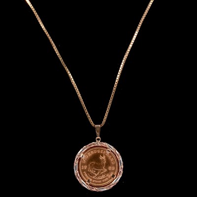 Lot 122 - A Gold  1/10 Krugerrand Coin pendant and chain.