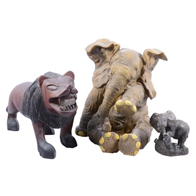 Lot 193 - A collection of elephant models in resin, ebony, other woods.